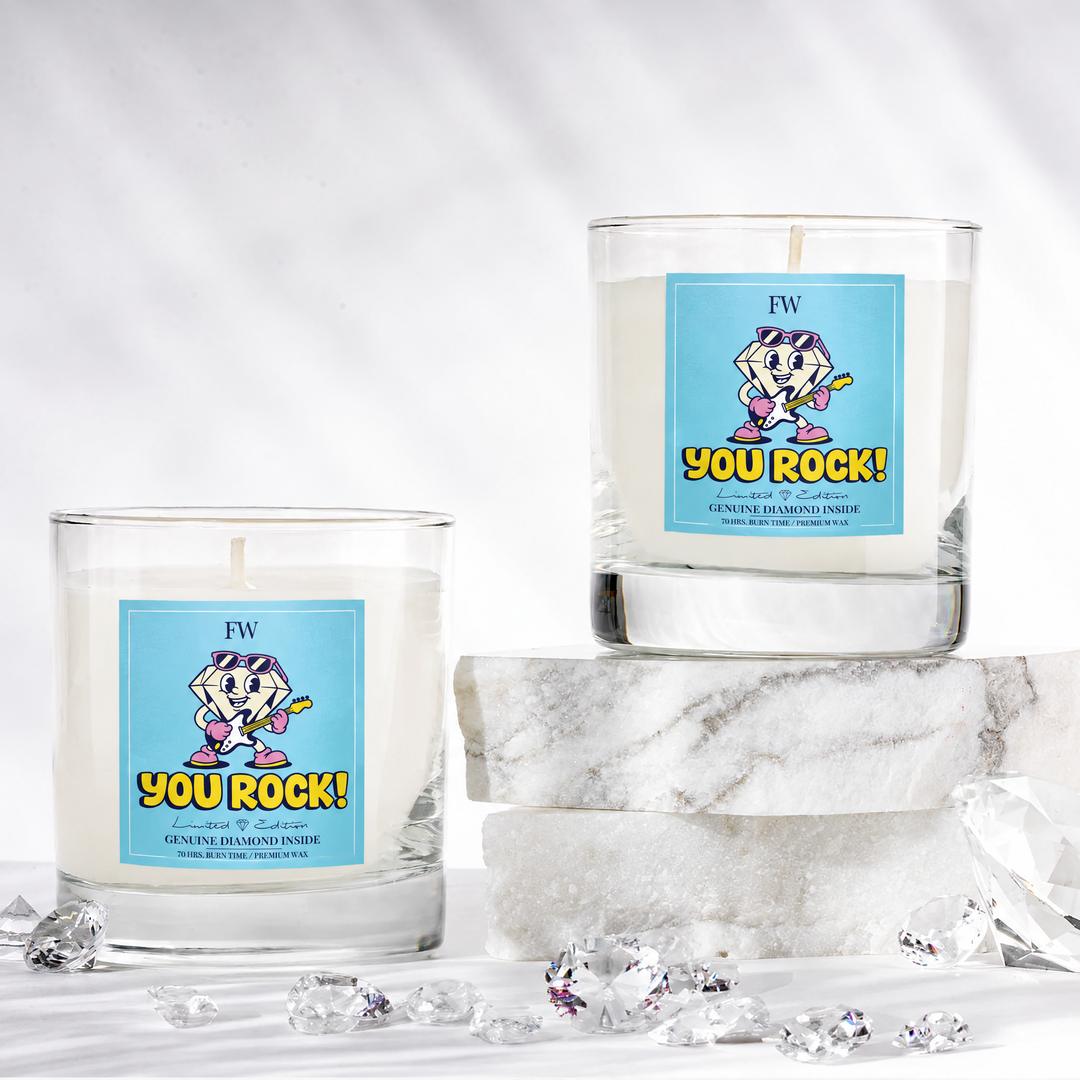 Two You Rock Diamond Candles with loose diamonds on marble